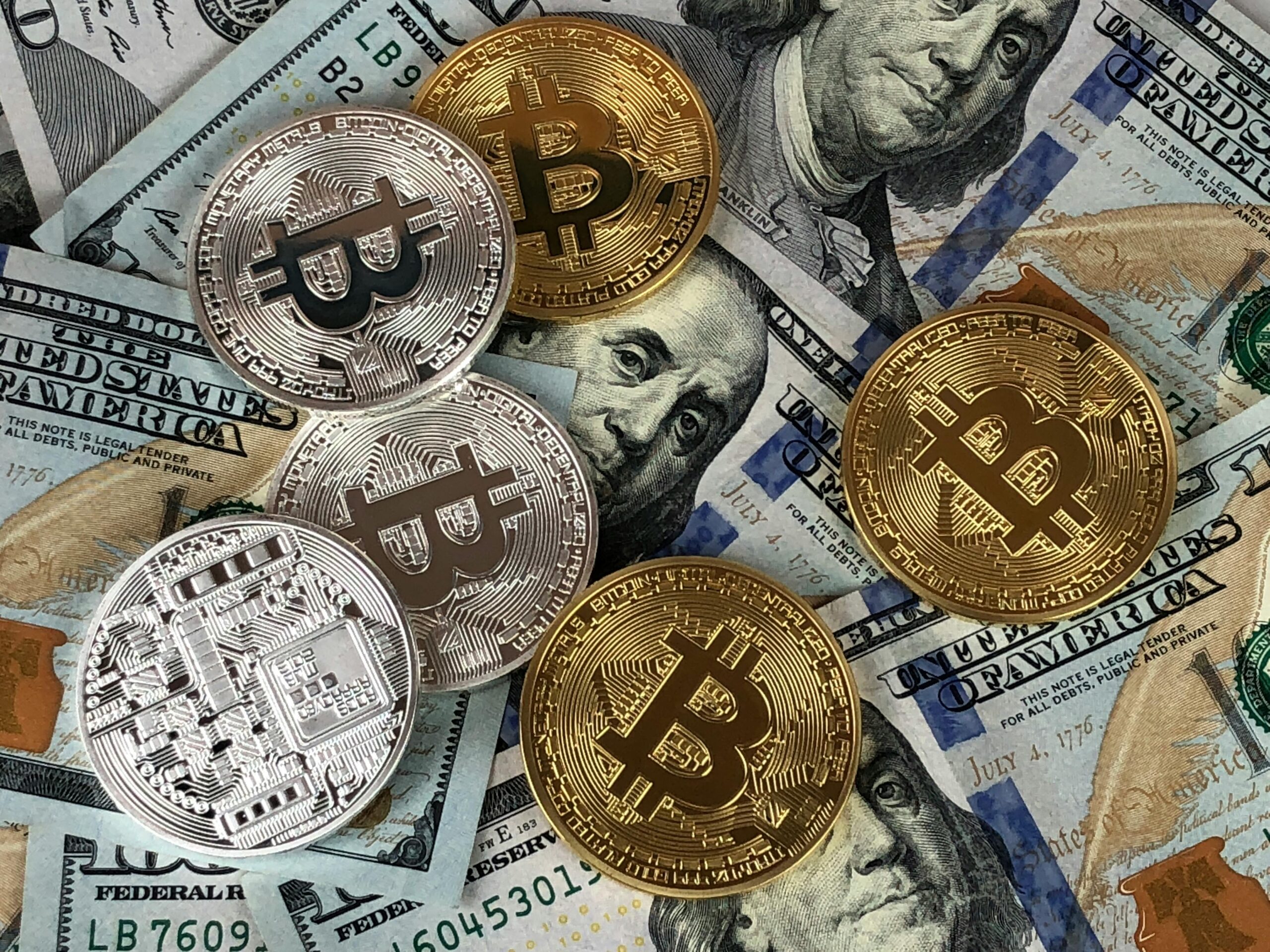 Bitcoin Weekly Market Overview Close-up of bitcoins and US dollar bills symbolizing modern finance and cryptocurrency.